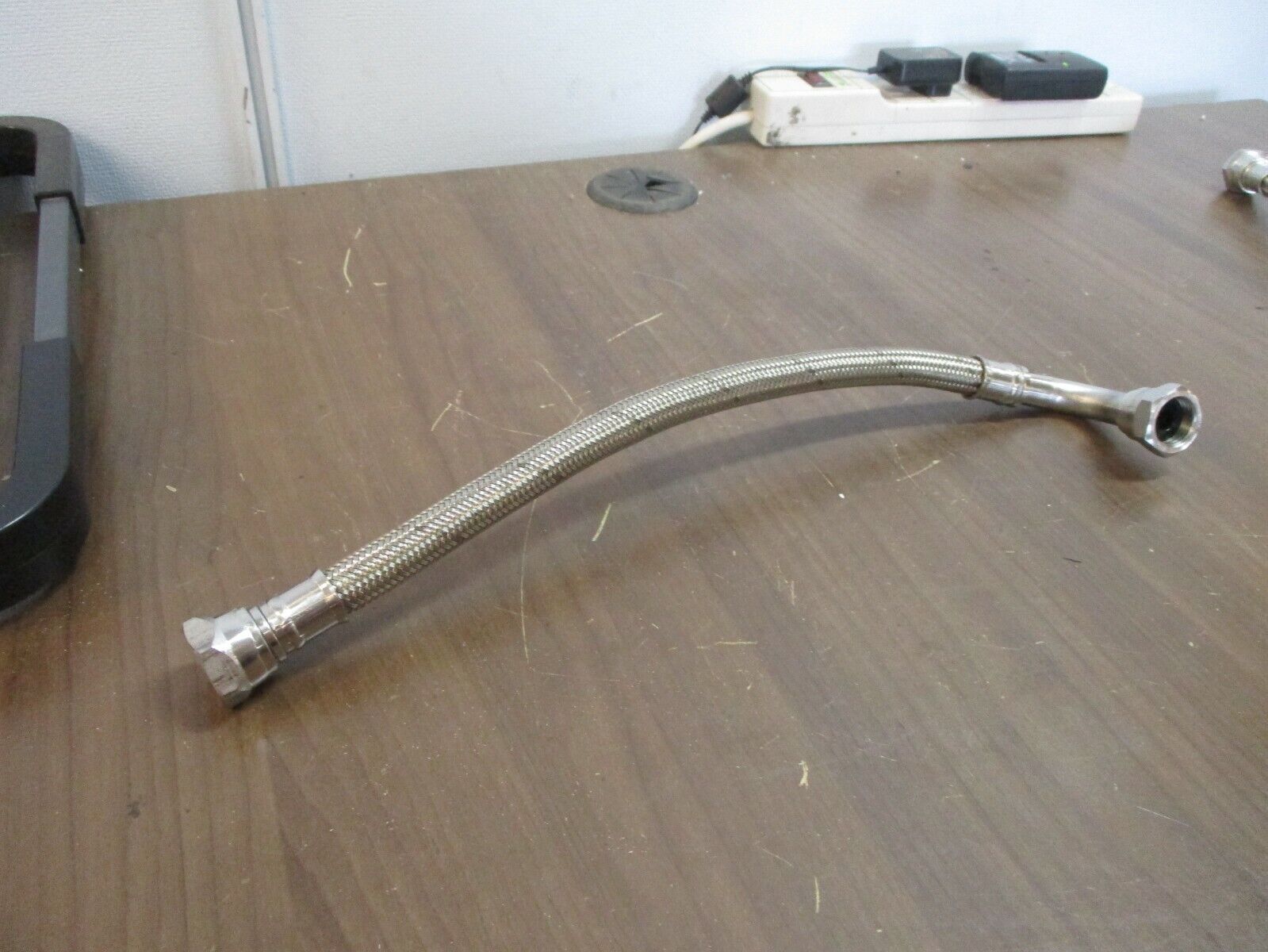 Argonic Stainless Steel Braided Hose Length: 12" End Size: 3/4" Used