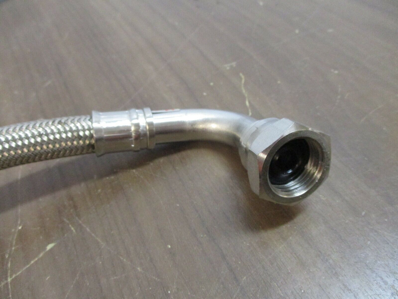 Argonic Stainless Steel Braided Hose Length: 12" End Size: 3/4" Used