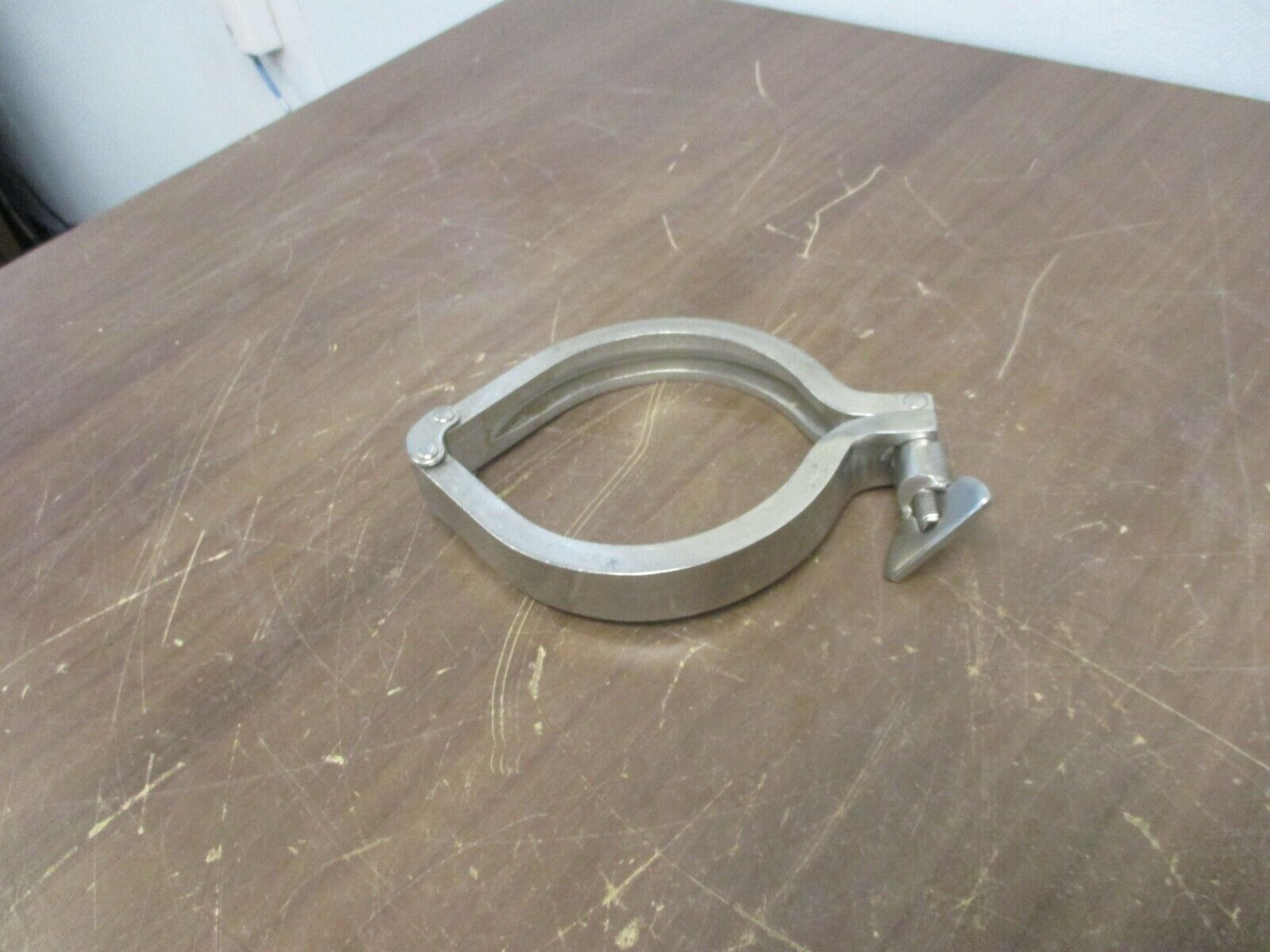 Misc. Brand Stainless Steel Sanitary Clamp Size: 4" Used