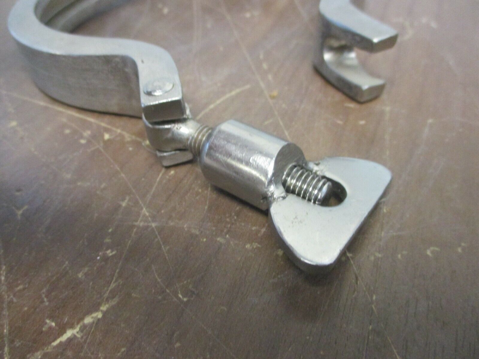 Misc. Brand Stainless Steel Sanitary Clamp Size: 4" Used
