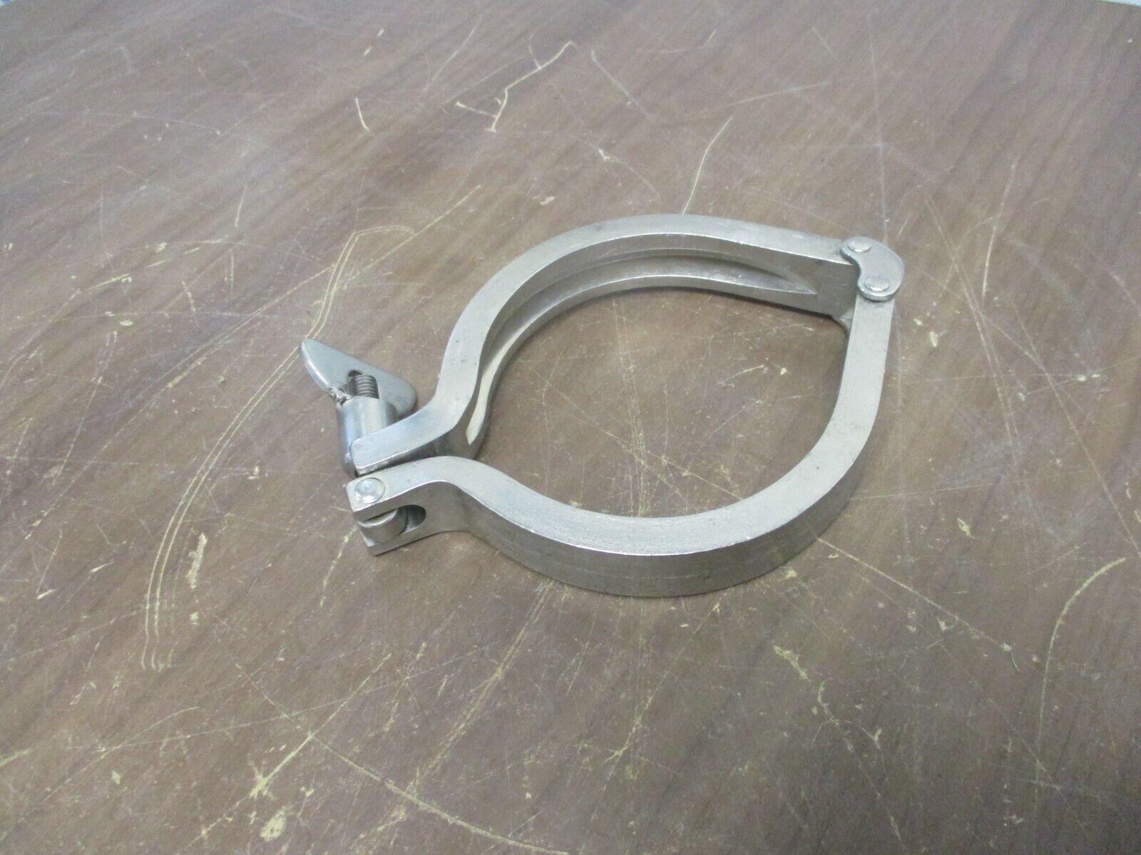 Misc. Brand Stainless Steel Sanitary Clamp Size: 4" Used
