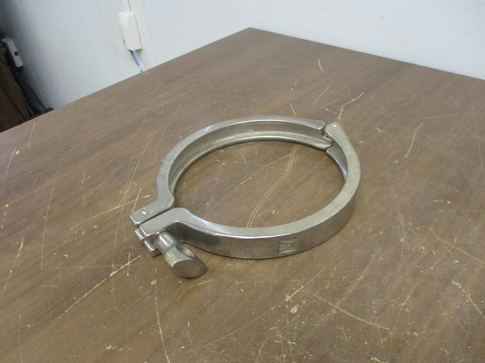 Misc. Brand Stainless Steel Sanitary Clamp Size: 6" Used